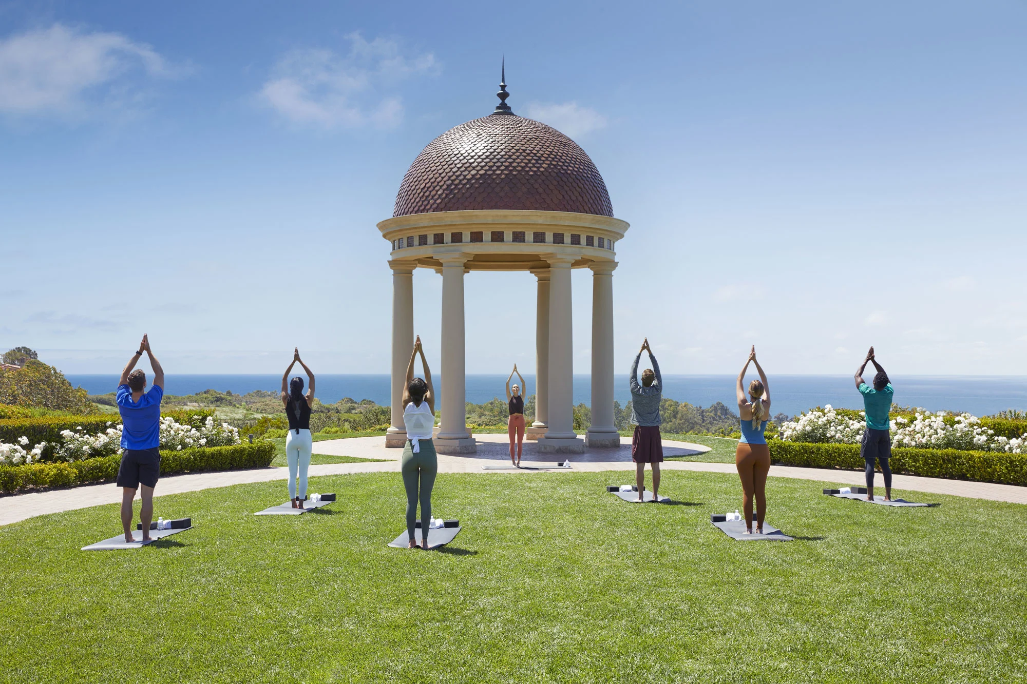 Resort at Pelican Hill yoga on the lawn overlooking Pacific Ocean